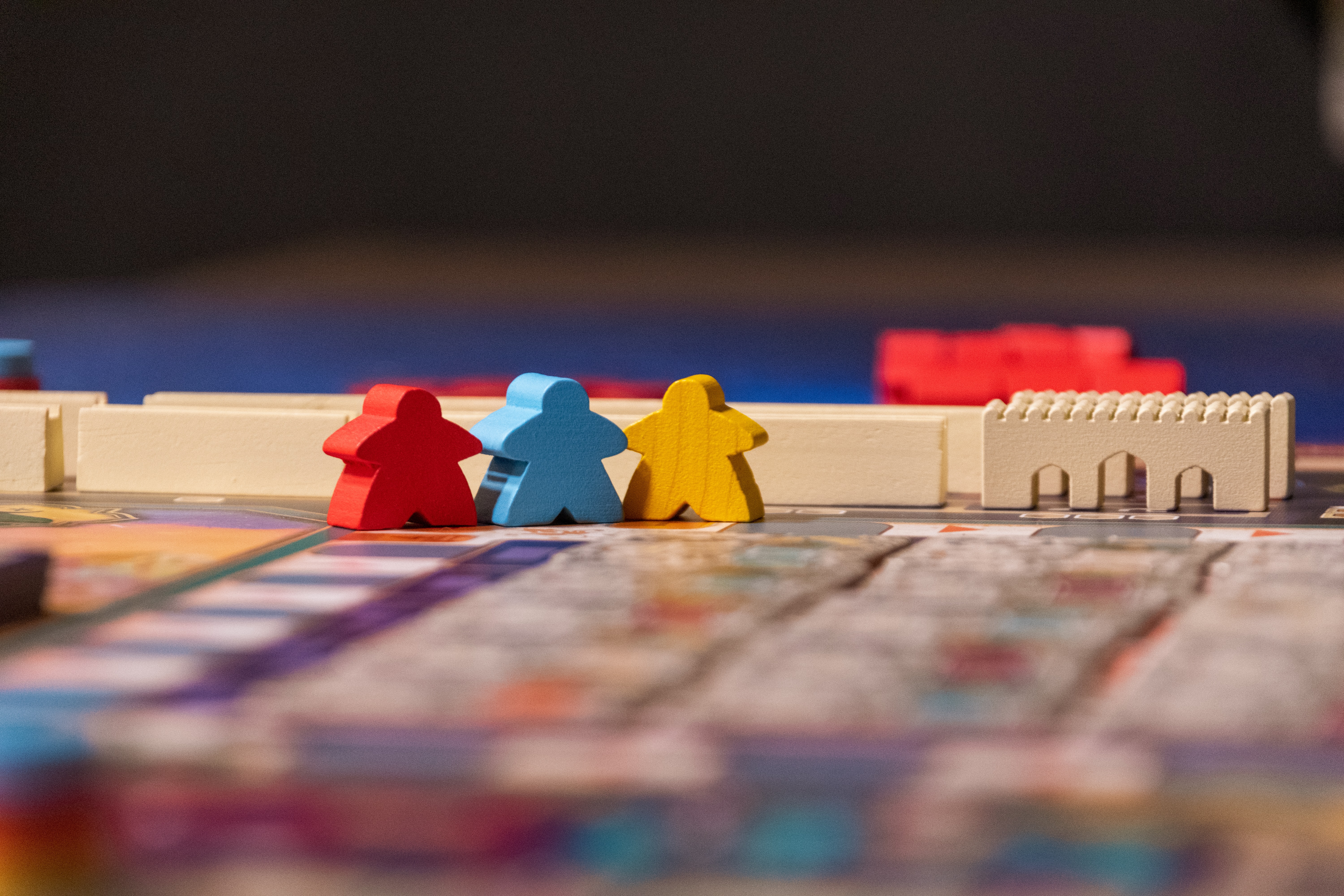 Hero image of Meeples on a playing board. -Christopher Paul